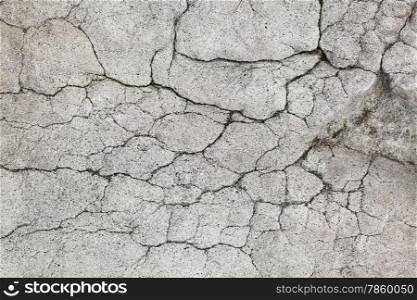 Image of a cracked stone surface. Cracked surface