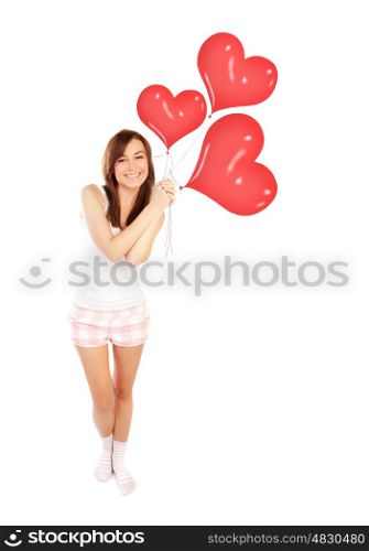 Image of a cute happy girl holding red heart balloons, fit woman smiling isolated on white background, freedom lifestyle, weight loss concept, romantic wish on Valentine day, love happiness and health