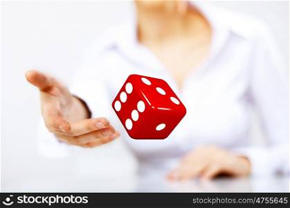 Image of a flying dice as symbol of risk and luck
