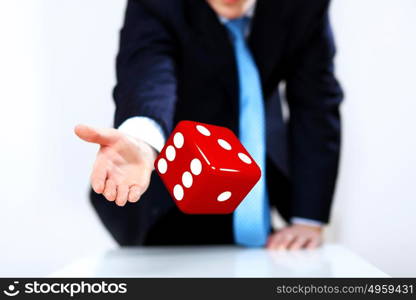 Image of a flying dice as symbol of risk and luck