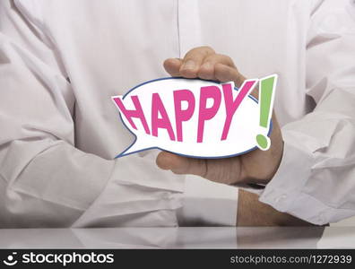 Image of a man hand holding speech balloon with the text happy, white shirt. Concept of happiness or happy customer.. Happy Concept