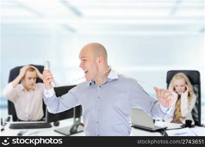 image of a nervous businessman screaming on the phone.