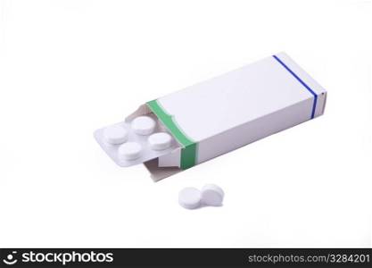 Image of a pills blister getting out form the box over white background