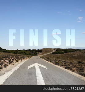 Image of a road with white arrow and finish sign