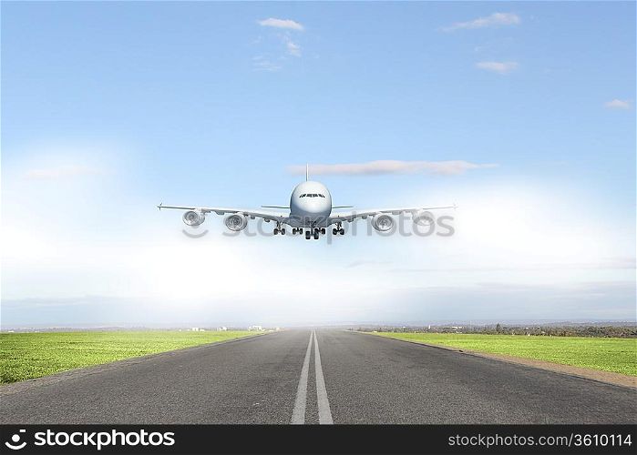 Image of a white flying passenger plane