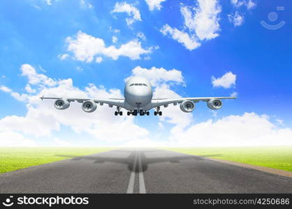 Image of a white flying passenger plane