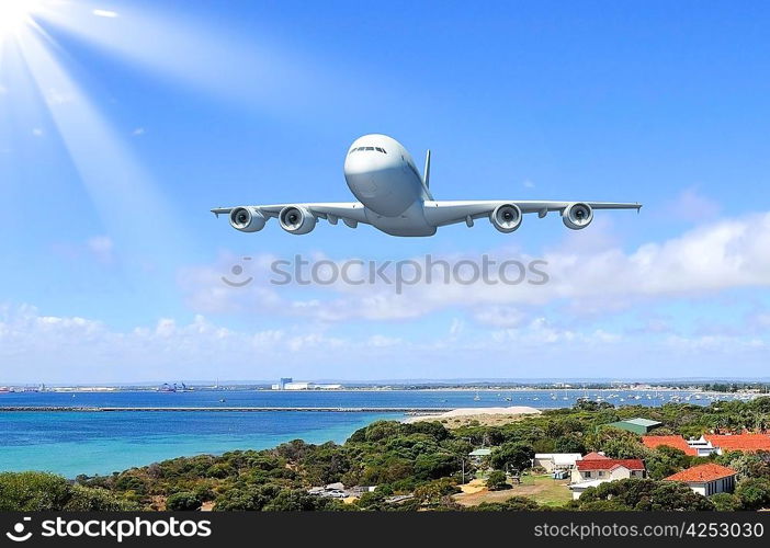 Image of a white flying passenger plane