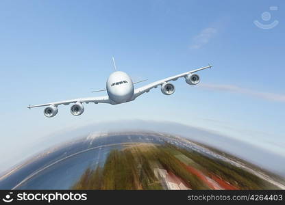 Image of a white flying passenger plane