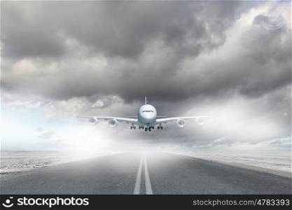 Image of a white flying passenger plane