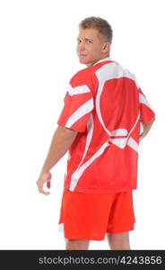 Image of a young football player with the ball in the red uniform. Isolated on white background