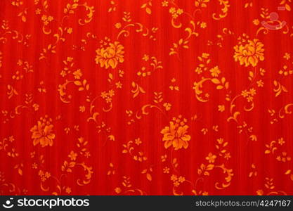 Image of abstract red background with golden flowers