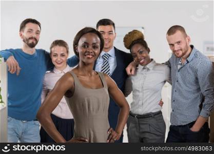 Image of African-American female business leader in front of her business team