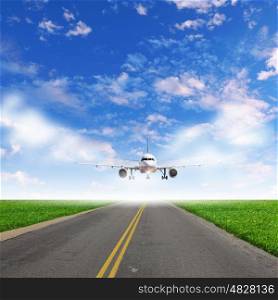 Image of airplane in blue cloudy sky