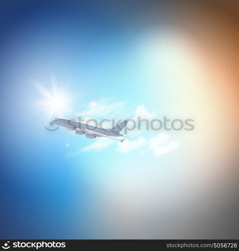 Image of airplane in sky. Image of flying airplane in clear sky with sun at background