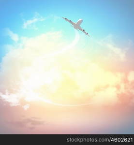 Image of airplane in sky. Image of flying airplane in sky with clouds at background