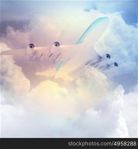 Image of airplane in sky. Image of flying airplane in sky with clouds at background