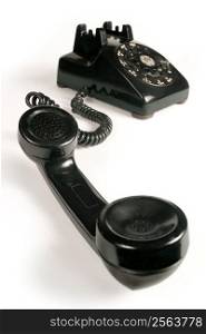 Image of an old beatup rotary telephone.