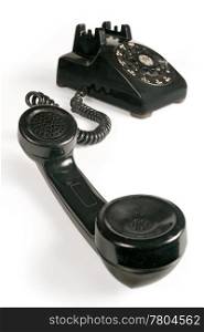 Image of an old beatup rotary telephone.