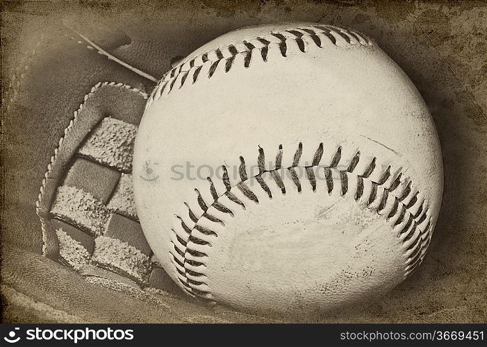 Image of baseball and catchers glove in vintage retro grunge stlye with added aged effects to give feel of nostalgia