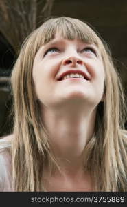 Image of beautiful blond woman looking upwards