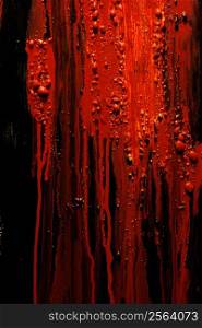 Image of blood and guts splattered against a black surface. Background image for horror / halloween, etc.