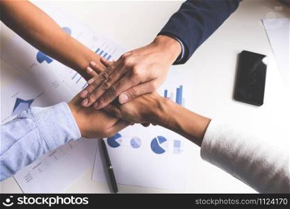 Image of business, Concept of Teamwork people joining hands.