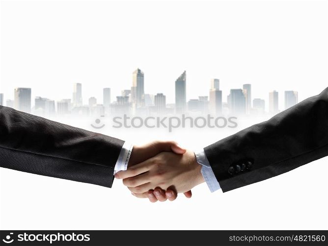 image of business handshake. business handshake against white background with city image