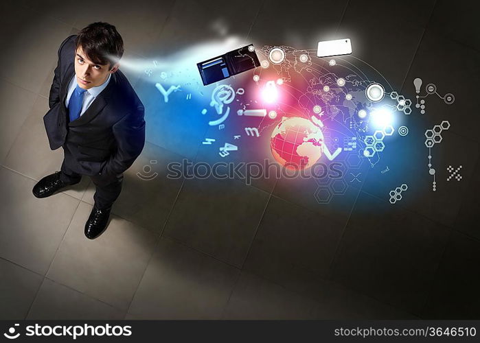 Image of business objects flying in air top view against businessman background