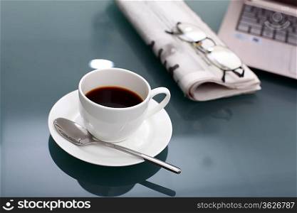 Image of business table with a cup of coffee and norebook