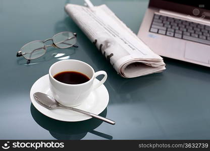 Image of business table with a cup of coffee and norebook