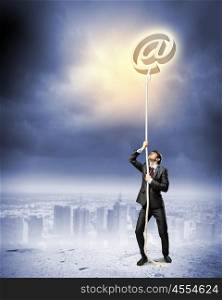 Image of businessman climbing rope. Image of businessman climbing rope attached to e-mail sign