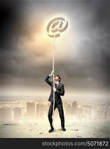 Image of businessman climbing rope. Image of businessman climbing rope attached to e-mail sign