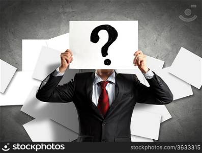 Image of businessman holding message board against face. Conceptual photo