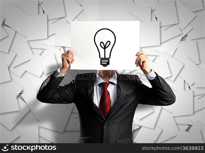 Image of businessman holding message board against face. Conceptual photo