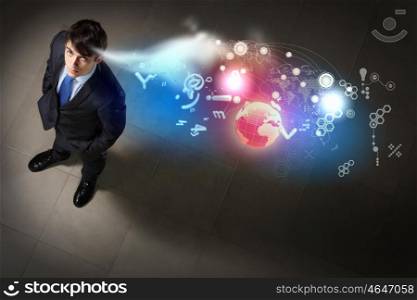 Image of businessman top view. Top view of young businessman making decision