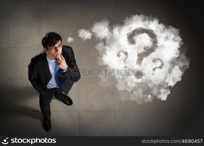 Image of businessman top view. Top view of young businessman making decision