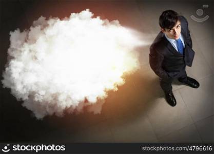Image of businessman top view. Top view of young businessman making decision with place for text