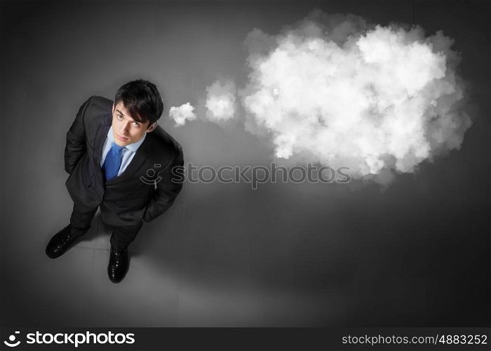 Image of businessman top view. Top view of young businessman making decision with place for text