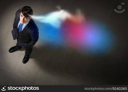 Image of businessman top view. Top view of young businessman making decision