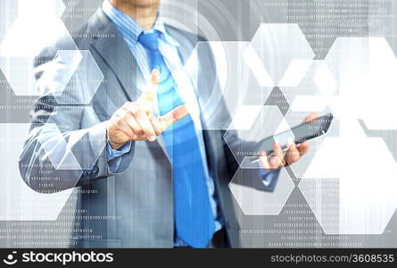 image of businessman touching screen with finger holding pad