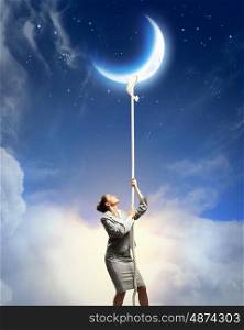 Image of businesswoman climbing the rope. Image of businesswoman climbing the rope to the moon