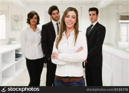 Image of businesswoman leader looking at camera in working environment