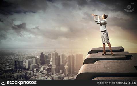 Image of businesswoman looking in telescope standing a top of building