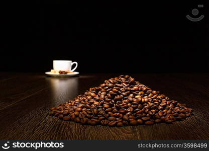 Image of coffee beans and white cup