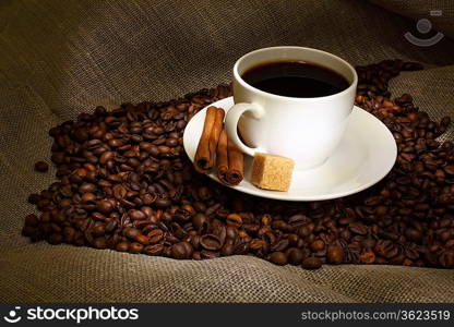 Image of coffee beans and white cup