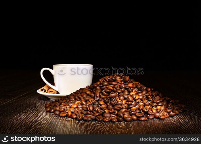 Image of coffee beans and white cup