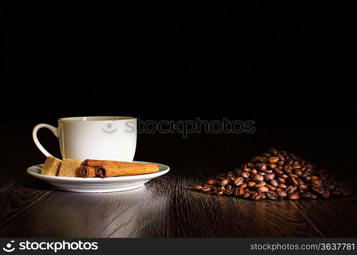 Image of coffee beans and white cup