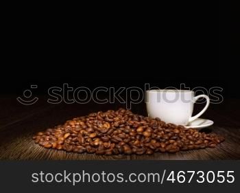 Image of coffee beans and white cup