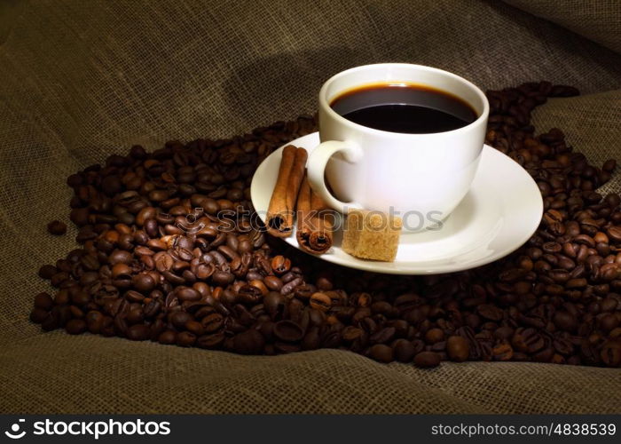 Image of coffee beans and white cup