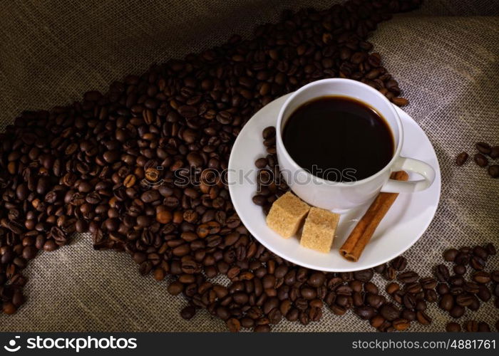 Image of coffee beans and white cup